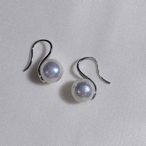 Dangling pearl earrings